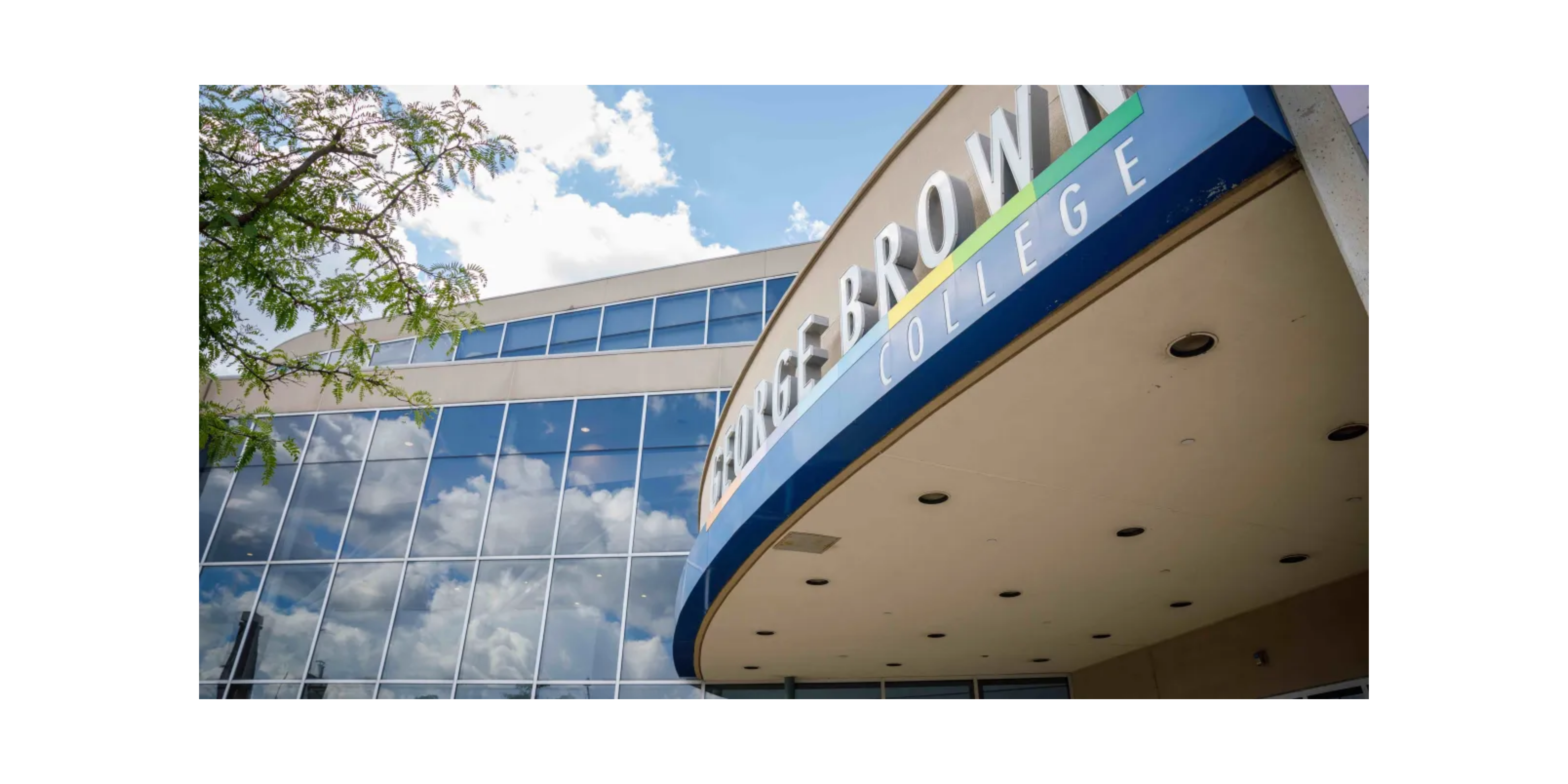 A male and female student walking towards a Casa Loma campus entrance near a George Brown College sign.